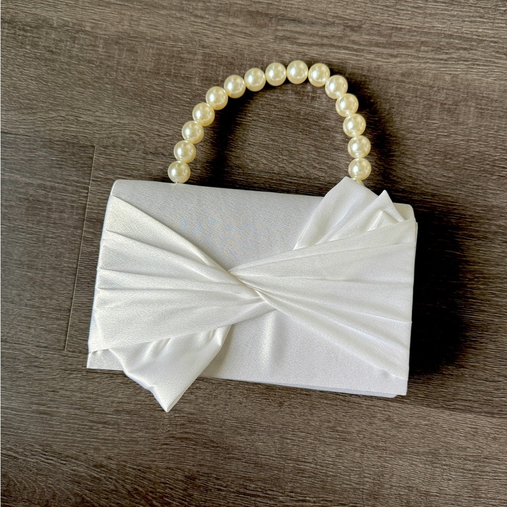 Elegant White Clutch with Pearl Handle